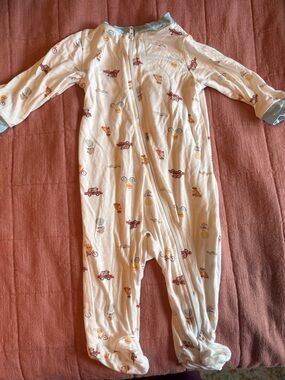 Milkberry Soft White Footed Baby One-Piece with Playful Vehicle Print